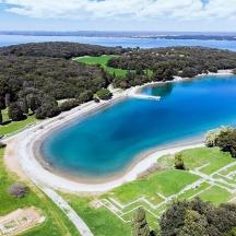 an aerial view of a beach and a body of water