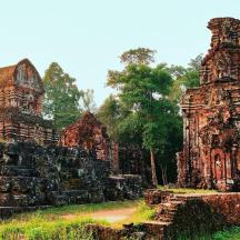 a group of ancient temples in a field
