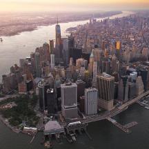 an aerial view of a large city on the water