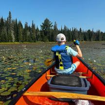 a man in a kayak on a river