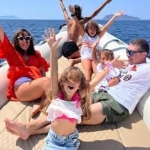 a group of people on a boat in the water