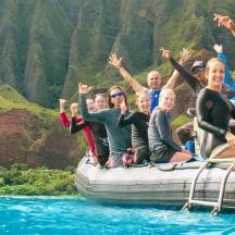 a group of people on a raft in the water