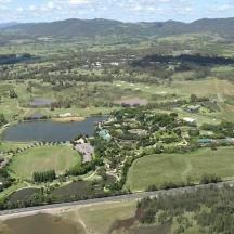 an aerial view of a park with two lakes