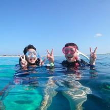a group of three people in the water
