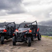 two atvs parked on top of a hill