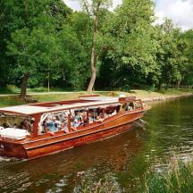 a group of people on a boat on a river