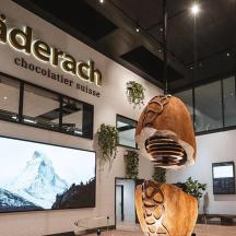a store with a large screen in front of a building