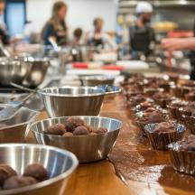 a counter with bowls of food in a kitchen