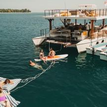 a group of people on a boat in the water