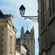 a street with a street light and a cathedral
