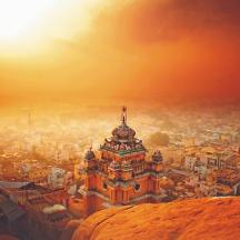 a view of a city at sunset with a building