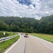 a group of people riding motorcycles on a road