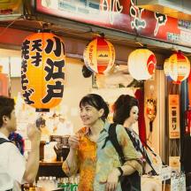 a group of people standing in a store with lanterns