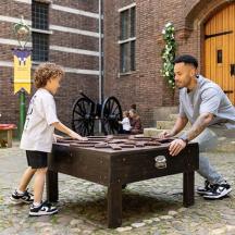 a man and a child playing with a table