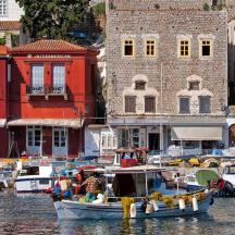 a boat is docked in a harbor with buildings