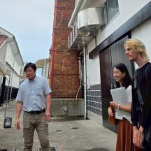 a man and a woman standing outside of a building