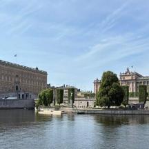 a bridge over a river in a city with buildings