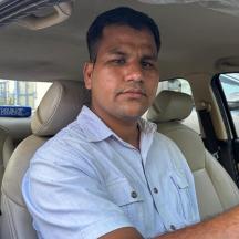 a man sitting in the back seat of a car