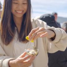 a woman is eating food from a bowl
