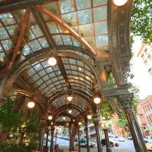 a building with a ceiling with lights and a street