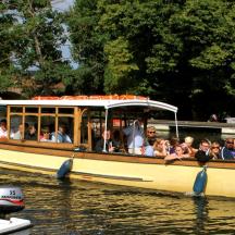 a group of people riding on a boat in the water