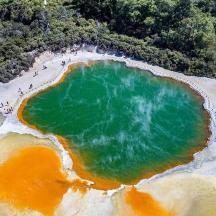 an aerial view of a large pool of green water