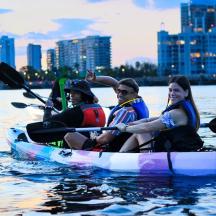 a group of people in a kayak on the water