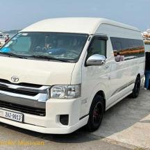 a white van parked next to the water