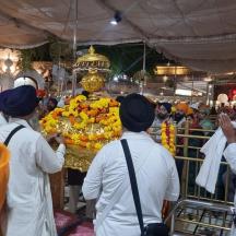 a group of people standing in front of a shrine