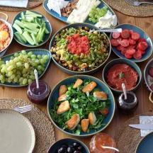 a table topped with bowls of different types of food