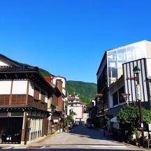 an empty street in a town with buildings