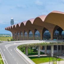 a large building with a road in front of it