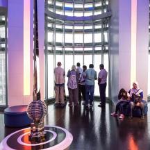 a group of people standing around in a building