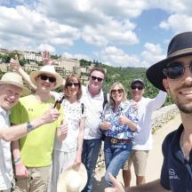 a group of people posing for a picture on a mountain