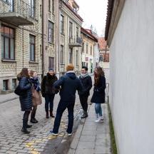 a group of people walking down a street