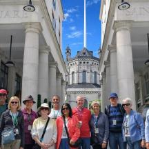a group of people standing in front of a building