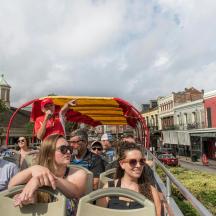 a group of people riding on a trolley