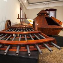a wooden boat on display in a room
