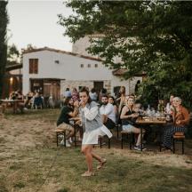 a woman is dancing in front of a group of people