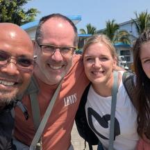 a group of three people posing for a picture