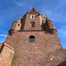 a brick building with a tower on top of it