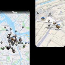 two cell phones with a map of a city