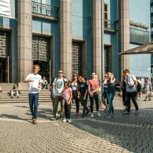 a group of people standing in front of a building