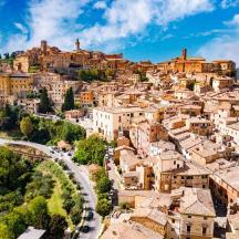 an aerial view of a town on a mountain