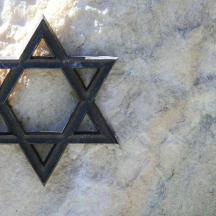 a black star on a stone wall