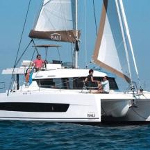 a group of people on a sailboat in the water