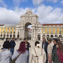 a group of people standing in front of a building