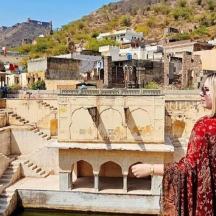a woman standing in front of a amphitheater