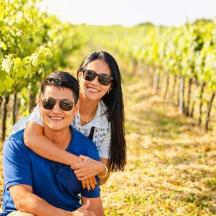 a man and a woman in a vineyard