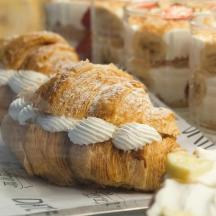a loaf of bread with whipped cream on it